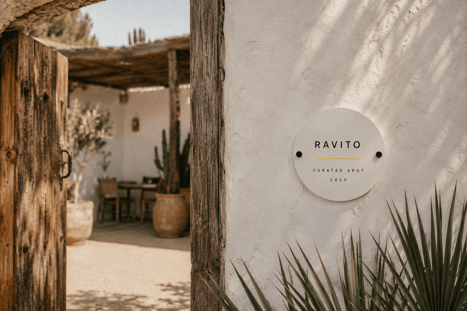 Ravito curated spot plaque on a venue wall